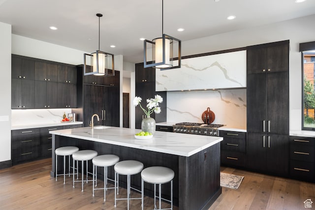 942 N Explorer Peak Dr Unit 420, Heber City, UT 84032 - kitchen featuring a breakfast bar area, hardwood / wood-style floors, tasteful backsplash, modern cabinets, and recessed lighting