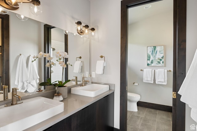 942 N Explorer Peak Dr Unit 420, Heber City, UT 84032 - full bathroom featuring double vanity, baseboards, toilet, and a chandelier