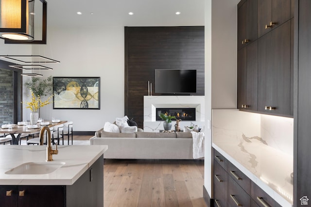 942 N Explorer Peak Dr Unit 420, Heber City, UT 84032 - living area with recessed lighting, light wood-type flooring, a large fireplace, and baseboards