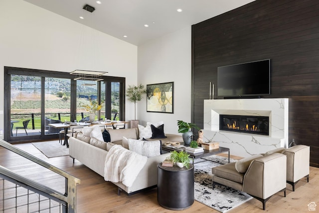 942 N Explorer Peak Dr Unit 420, Heber City, UT 84032 - living room with a high ceiling, wood finished floors, recessed lighting, and a high end fireplace