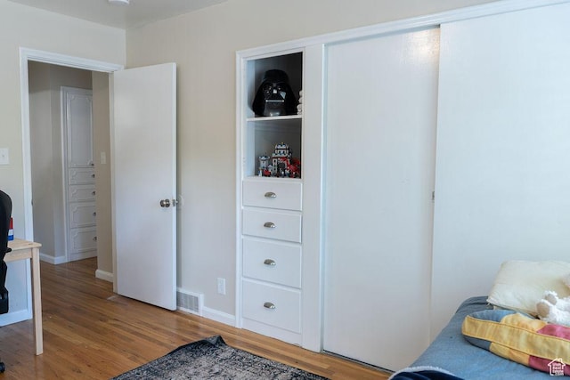1444 S Beacon Dr E, Salt Lake City, UT 84108 - bedroom featuring wood finished floors, baseboards, and an office area