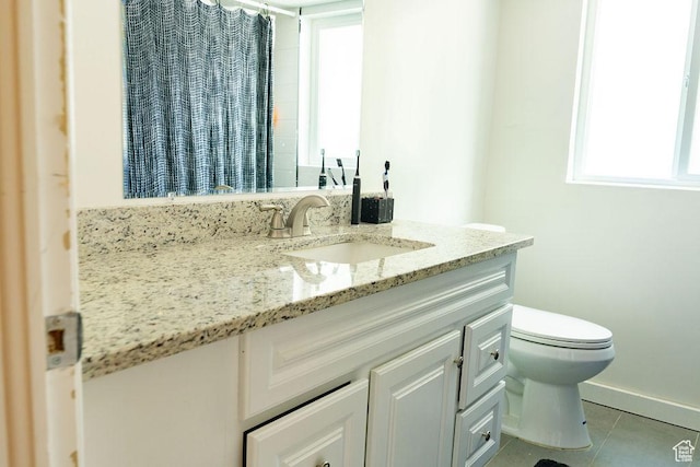 1444 S Beacon Dr E, Salt Lake City, UT 84108 - full bath featuring vanity, tile patterned floors, toilet, baseboards, and a shower with shower curtain