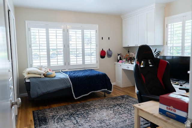 1444 S Beacon Dr E, Salt Lake City, UT 84108 - bedroom featuring wood finished floors and baseboards