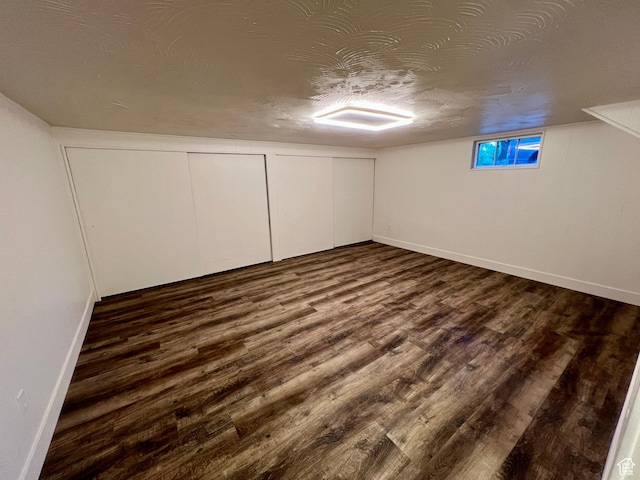 144 S 100 W, Tremonton, UT 84337 - basement with dark wood-type flooring, baseboards, and a textured ceiling