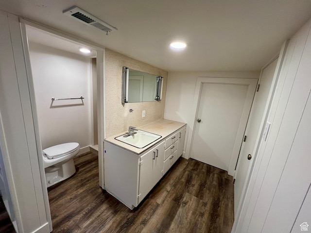 144 S 100 W, Tremonton, UT 84337 - bathroom featuring vanity, toilet, wood finished floors, and recessed lighting