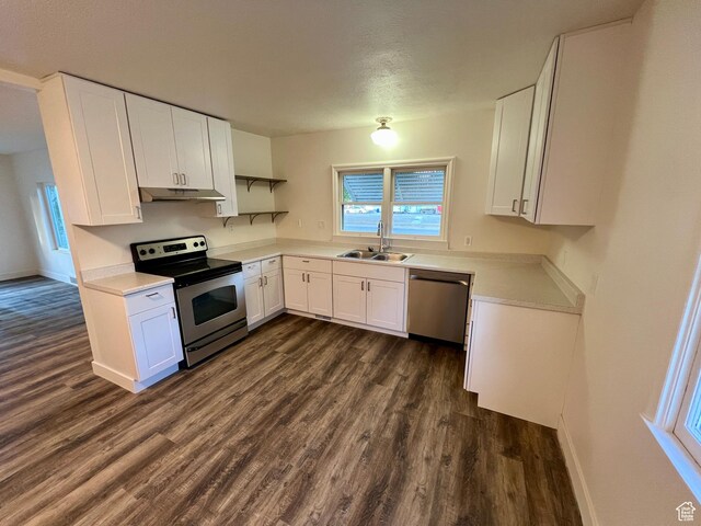 144 S 100 W, Tremonton, UT 84337 - kitchen featuring appliances with stainless steel finishes, a sink, dark wood-type flooring, and white cabinets