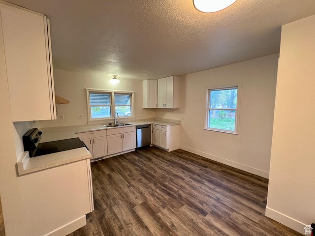 144 S 100 W, Tremonton, UT 84337 - kitchen featuring range with electric cooktop, a sink, stainless steel dishwasher, dark wood finished floors, and baseboards