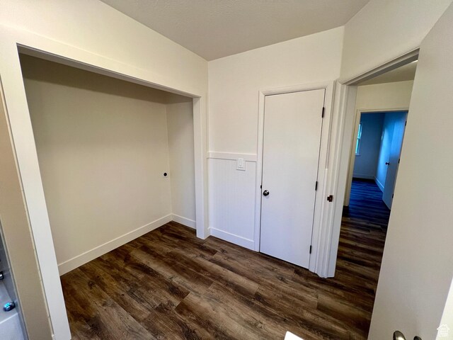 144 S 100 W, Tremonton, UT 84337 - unfurnished bedroom with dark wood-style floors and a closet