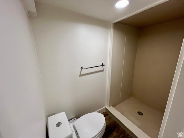 144 S 100 W, Tremonton, UT 84337 - full bathroom with toilet, a shower stall, wood finished floors, and baseboards