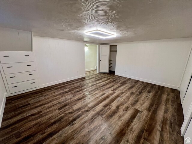 144 S 100 W, Tremonton, UT 84337 - finished basement featuring dark wood-style floors, baseboards, and a textured ceiling