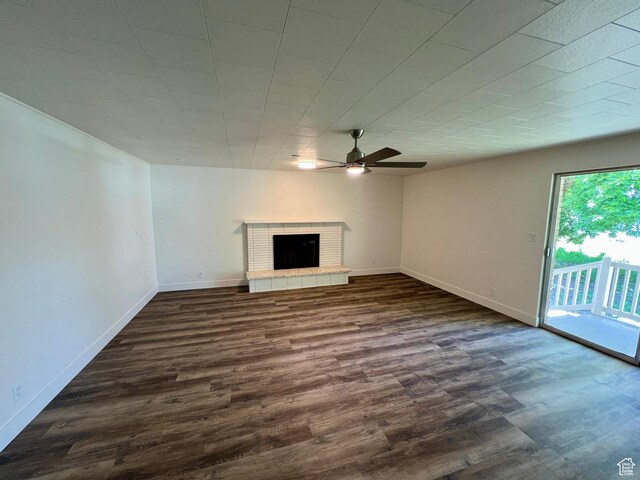 144 S 100 W, Tremonton, UT 84337 - unfurnished living room with ceiling fan, dark wood-style floors, a fireplace, and baseboards