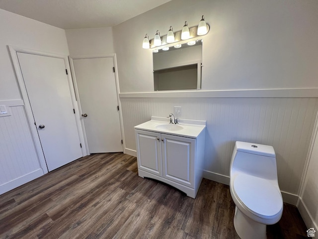 144 S 100 W, Tremonton, UT 84337 - bathroom featuring wainscoting, vanity, wood finished floors, and toilet