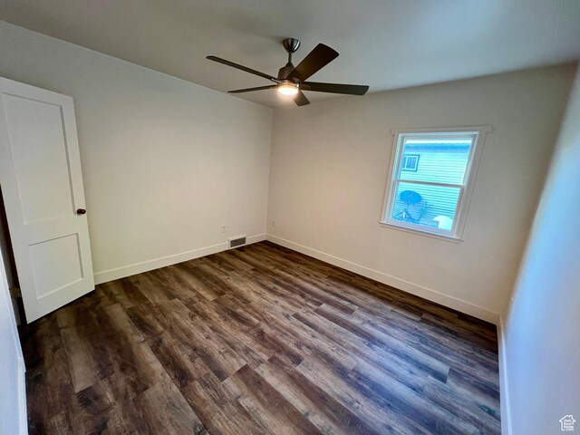 144 S 100 W, Tremonton, UT 84337 - spare room with a ceiling fan, dark wood-style flooring, and baseboards