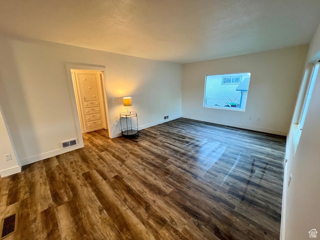 144 S 100 W, Tremonton, UT 84337 - unfurnished bedroom with dark wood-style floors and baseboards