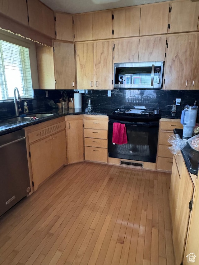 999 N Grand Ave, Provo, UT 84604 - kitchen with stainless steel appliances, a sink, decorative backsplash, and light brown cabinetry