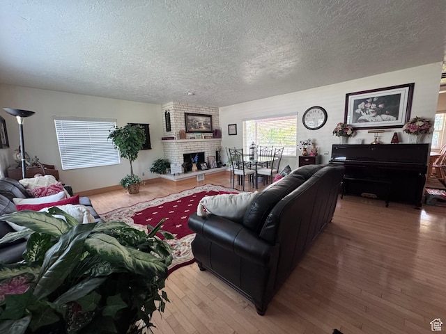 999 N Grand Ave, Provo, UT 84604 - living area with a textured ceiling, wood finished floors, and a fireplace