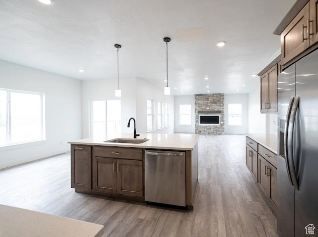 709 E 2450 N, North Logan, UT 84341 - kitchen featuring stainless steel appliances, a sink, light wood-style flooring, light countertops, and recessed lighting