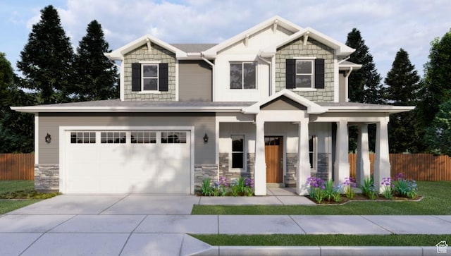 709 E 2450 N, North Logan, UT 84341 - craftsman-style house with driveway, stone siding, and an attached garage