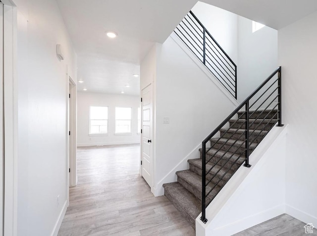 709 E 2450 N, North Logan, UT 84341 - staircase with baseboards, wood finished floors, and recessed lighting