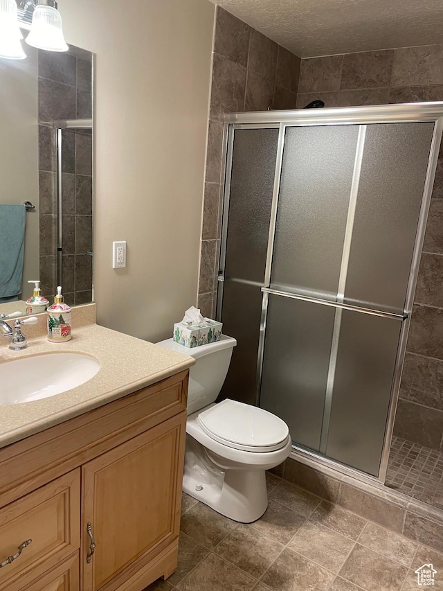 536 E 2200 N, North Ogden, UT 84414 - bathroom with vanity, a shower stall, and toilet