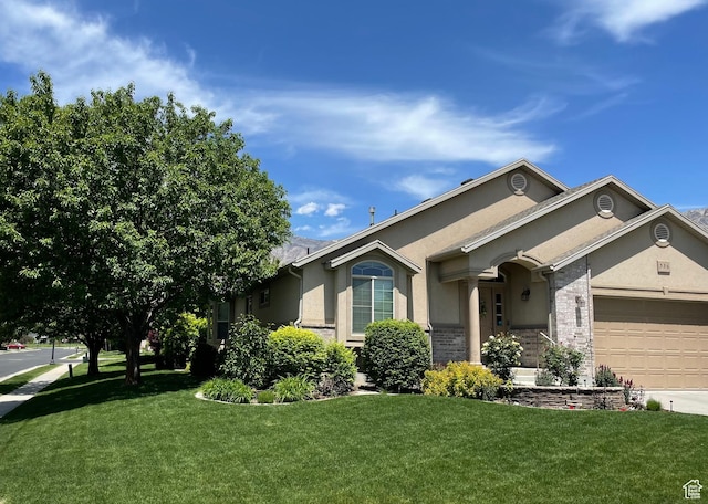 536 E 2200 N, North Ogden, UT 84414 - single story home with stucco siding, a garage, a front yard, and driveway