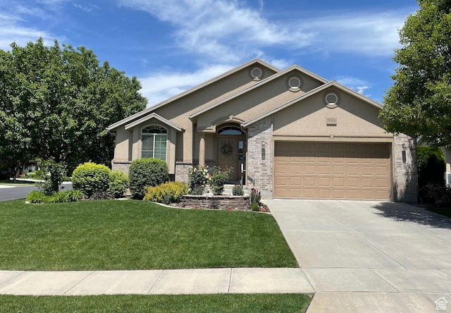 536 E 2200 N, North Ogden, UT 84414 - single story home with stucco siding, driveway, an attached garage, a front yard, and stone siding