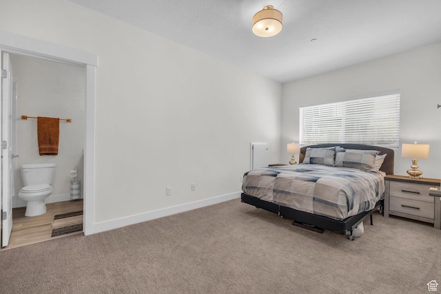 3041 Cedar Dr, Park City, UT 84098 - bedroom featuring light colored carpet, baseboards, and connected bathroom