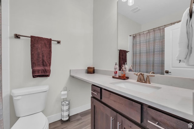 3041 Cedar Dr, Park City, UT 84098 - full bathroom with vanity, toilet, wood finished floors, baseboards, and a shower with shower curtain