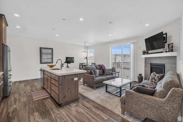 3041 Cedar Dr, Park City, UT 84098 - living room featuring a tiled fireplace, dark wood-style flooring, recessed lighting, and baseboards