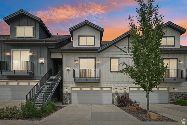 3041 Cedar Dr, Park City, UT 84098 - view of property with a garage, roof with shingles, stone siding, and concrete driveway