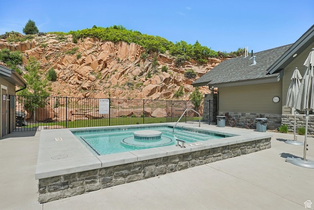 3041 Cedar Dr, Park City, UT 84098 - view of swimming pool with a patio area, a swimming pool, and an in-ground hot tub