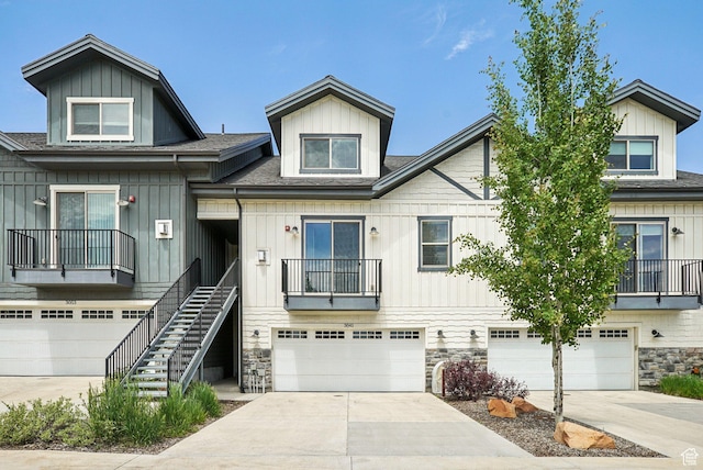 3041 Cedar Dr, Park City, UT 84098 - multi unit property featuring an attached garage, roof with shingles, stone siding, and concrete driveway