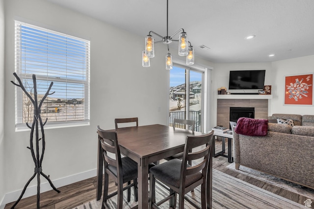 3041 Cedar Dr, Park City, UT 84098 - dining room with wood finished floors, baseboards, recessed lighting, and a fireplace