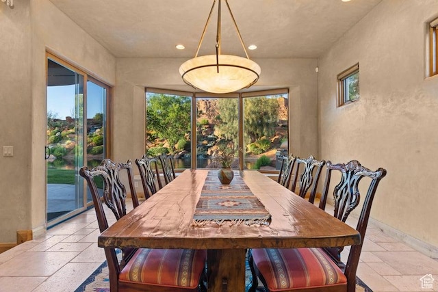 2405 W Entrada Trl Unit 76, St George, UT 84770 - dining space featuring stone tile flooring, recessed lighting, and baseboards