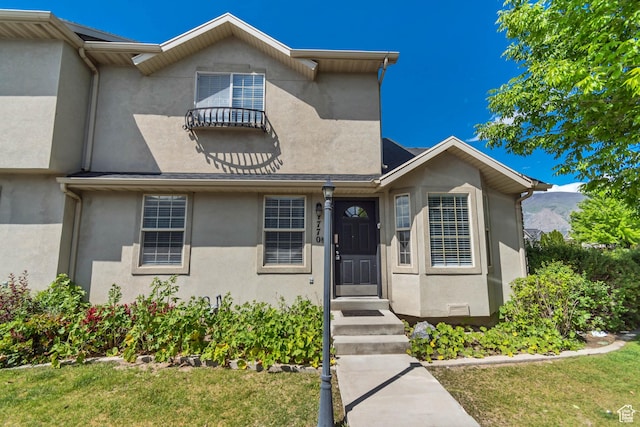 1770 W 950 S, Springville, UT 84663 - view of front of house with stucco siding, a front lawn, and a mountain view