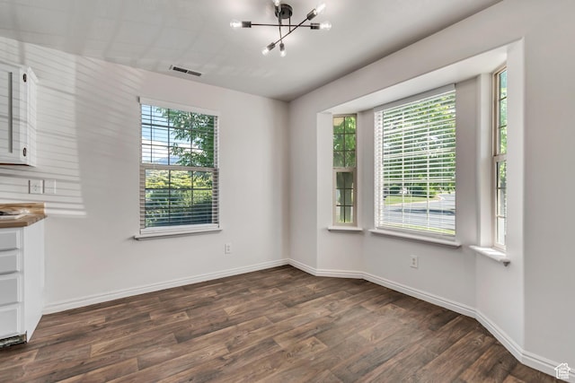 1770 W 950 S, Springville, UT 84663 - unfurnished dining area featuring dark wood-style flooring, a chandelier, and baseboards