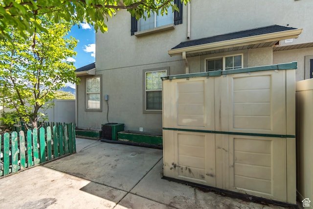 1770 W 950 S, Springville, UT 84663 - back of house with stucco siding, a patio, and roof with shingles