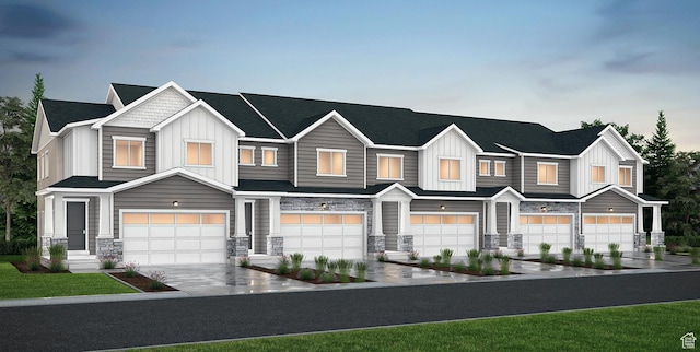 6858 S Mt Meek Dr Unit 211, West Jordan, UT 84081 - townhome / multi-family property with board and batten siding, stone siding, and a garage