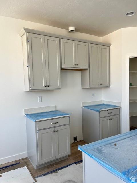 6858 S Mt Meek Dr Unit 211, West Jordan, UT 84081 - laundry room featuring light wood finished floors and baseboards