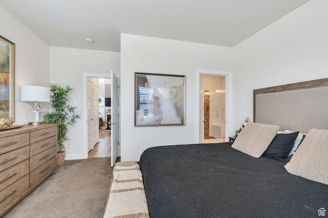 10394 S Crow Wing Dr, South Jordan, UT 84009 - carpeted bedroom featuring ensuite bath and baseboards