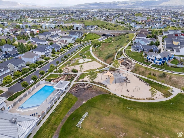 10394 S Crow Wing Dr, South Jordan, UT 84009 - aerial view of property and surrounding area featuring a pool, nearby suburban area, and mountains