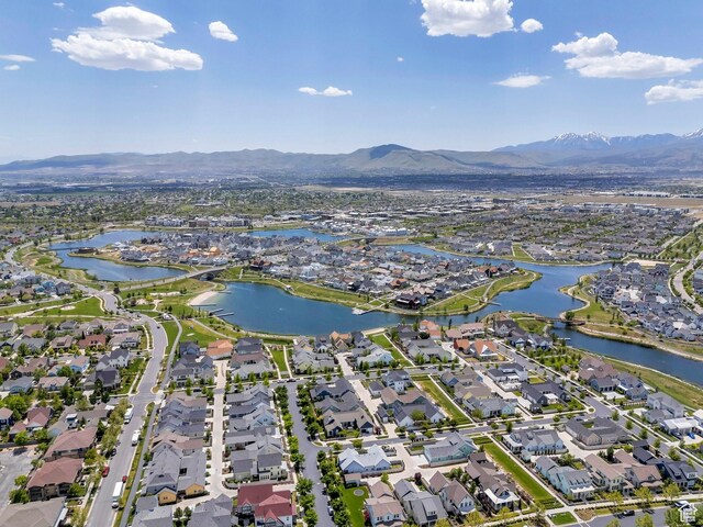 10394 S Crow Wing Dr, South Jordan, UT 84009 - aerial view of property's location with nearby suburban area and a water and mountain view