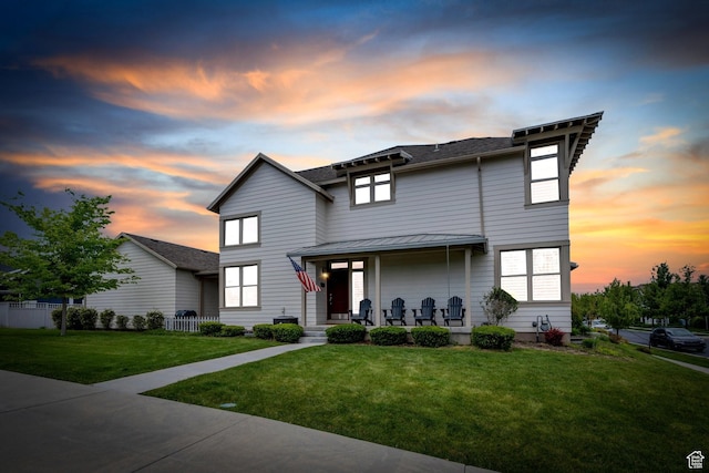 10394 S Crow Wing Dr, South Jordan, UT 84009 - view of front facade with a front yard, covered porch, a standing seam roof, and metal roof