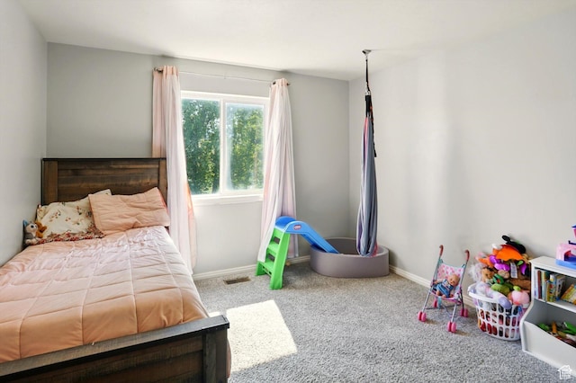 679 S Trail Cir W, Logan, UT 84341 - carpeted bedroom featuring baseboards