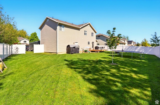 679 S Trail Cir W, Logan, UT 84341 - rear view of house featuring a trampoline