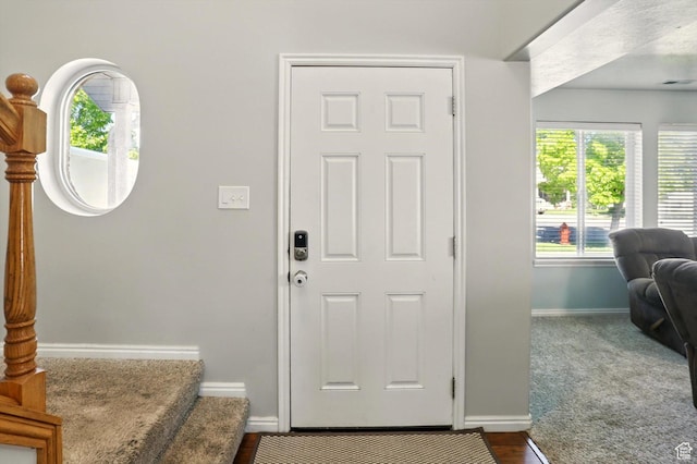 679 S Trail Cir W, Logan, UT 84341 - foyer with baseboards and stairs