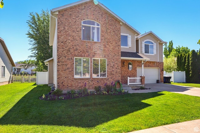 679 S Trail Cir W, Logan, UT 84341 - traditional-style home with an attached garage, driveway, and brick siding