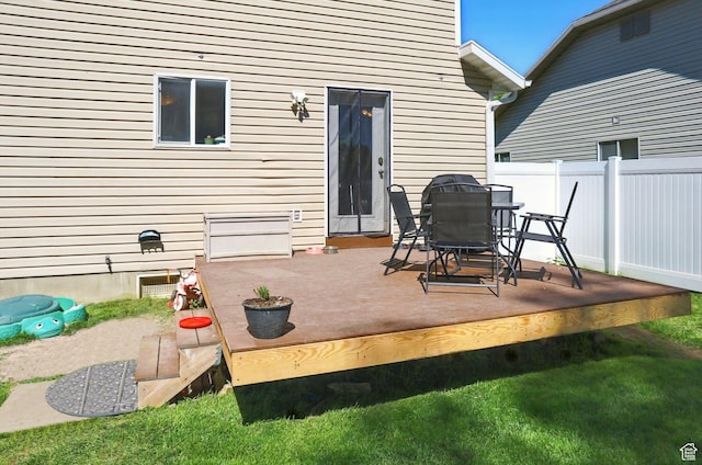 679 S Trail Cir W, Logan, UT 84341 - view of patio featuring a wooden deck and outdoor dining area