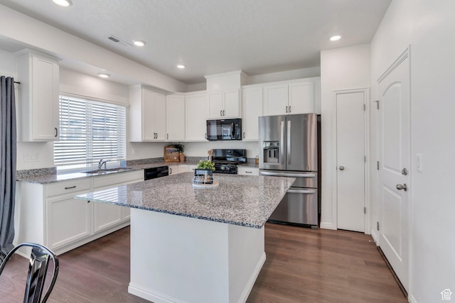 97 E Polaris Dr S Unit 394, Saratoga Springs, UT 84045 - kitchen featuring black appliances, white cabinetry, a center island, and recessed lighting