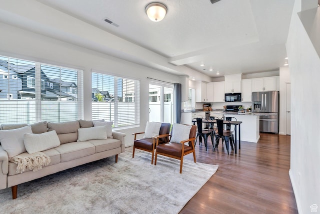 97 E Polaris Dr S Unit 394, Saratoga Springs, UT 84045 - living area with dark wood-style floors, recessed lighting, and baseboards